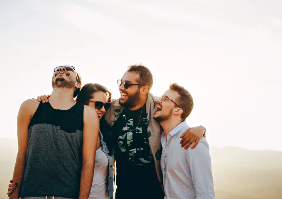Friends laughing together outdoors