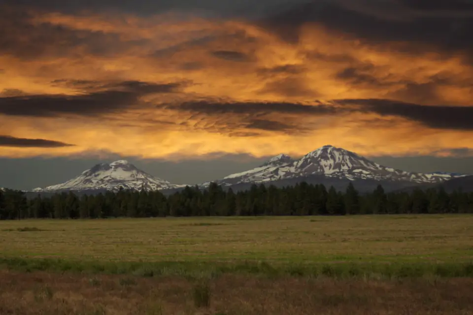 Mountains rising above a valley at dusk